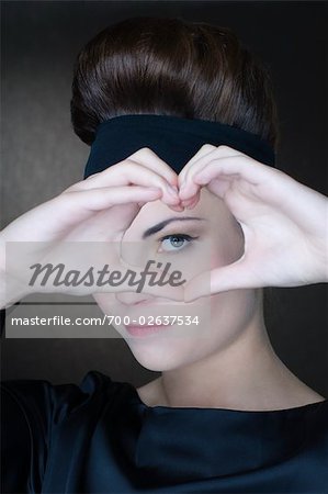 Portrait of Woman Making the Shape of a Heart With Her Hands Portrait of Woman Making the Shape of a Heart With Her Hands