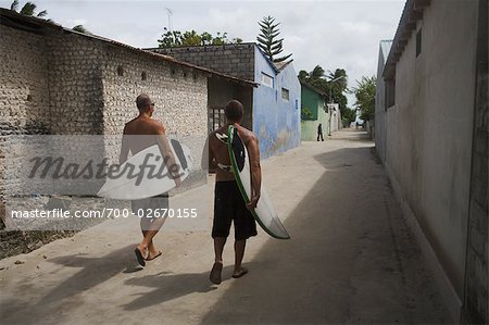 Surfers Walking Through Town on North Male Atoll, Maldives