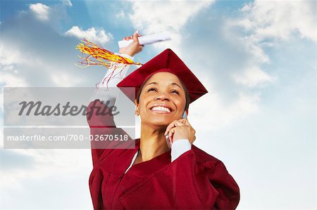Graduate Cheering and Talking on Cell Phone