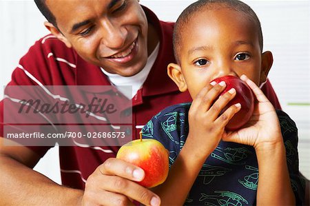 Father and Son Eating Apples