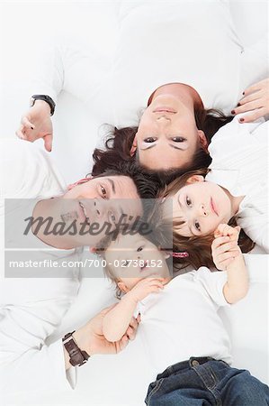 Portrait of Family Lying in a Circle
