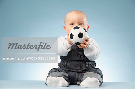 Baby Boy Playing With Soccer Ball