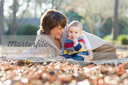 Mother and Baby Outdoors in Autumn