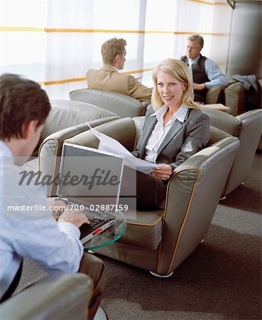 Business People Waiting in Airport Lounge