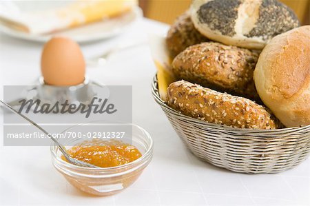 Bowl of Marmalade and Basket of Bread on Breakfast Table