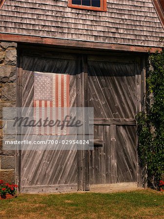 American Flag On Old Barn Door Maine Usa Stock Photo