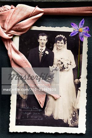 Old Wedding Photo in Album with Ribbon and Pressed Flower