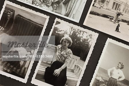 Close-Up of Photographs in Photo Album