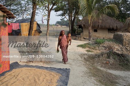 Mother Carrying Child, Namkhana Village, South 24 Parganas District, West Bengal, India