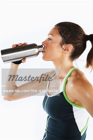 Woman Drinking From Stainless Steel Water bottle
