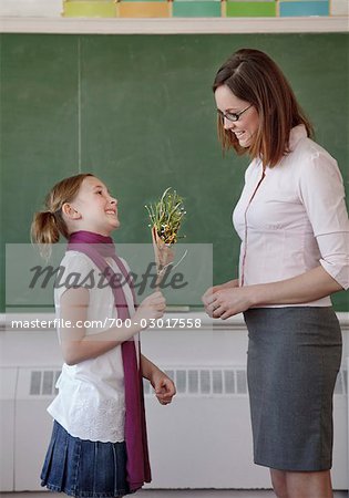 Student Giving Teacher Flowers