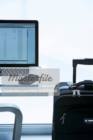 Laptop Computer, iPhone and Luggage