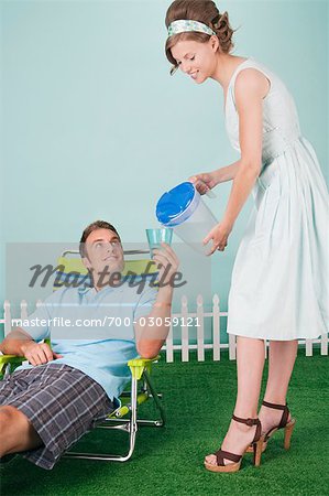 Woman Pouring Man a Drink