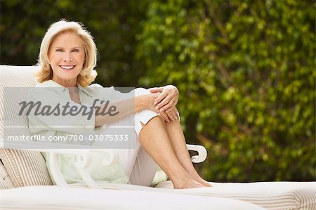 Portrait of Woman Sitting on Lounge Chair