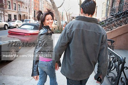 Young Couple Walking Down the Street