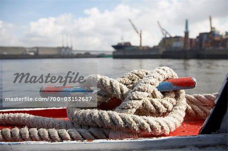 https://image1.masterfile.com/getImage/700-03152687em-ships-rope-tied-at-port-stock-photo.jpg