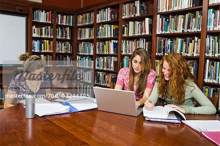 College Students Studying in Library