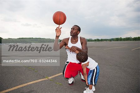 Father and Son Playing Basketball