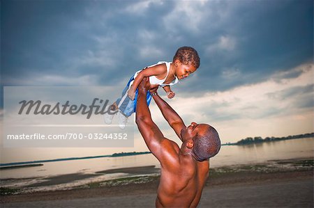 Father and Son Playing on the Beach