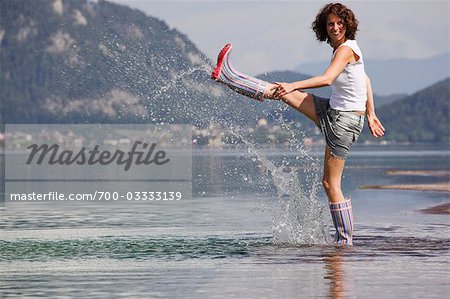 Woman Kicking in Shallow Water,  Fuschlsee, Salzburg, Austria