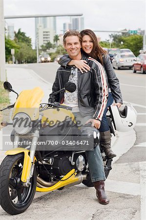 Portrait of Couple Sitting on Motorcycle