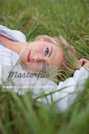 Teenager Lying in Grass