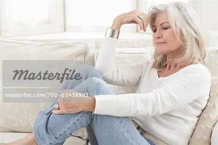 Woman Sitting on Sofa