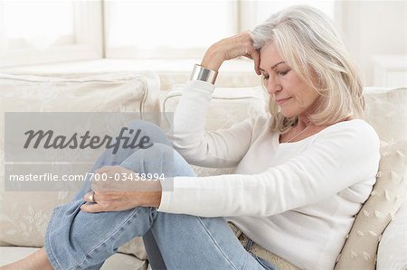 Woman Sitting on Sofa