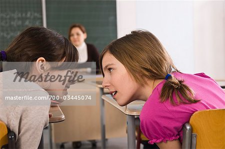 Students Whispering in Class