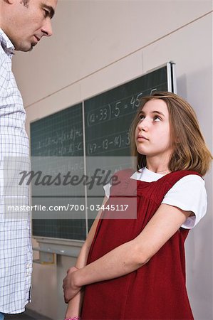 Student and Teacher Facing One Another