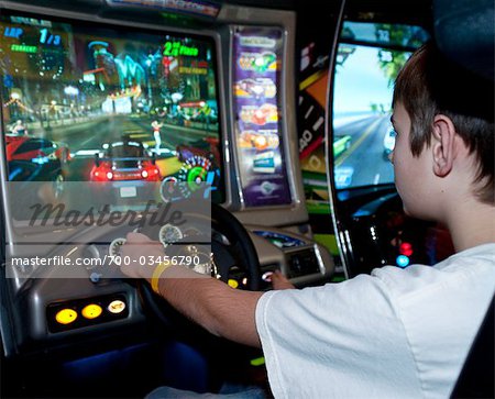 Boy Playing Arcade Game