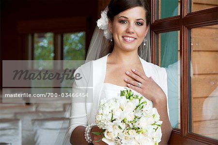 Portrait of Bride holding Bouquet