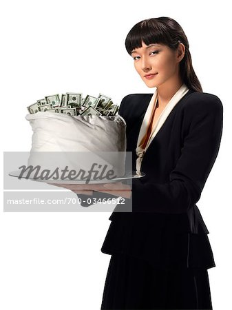 Businesswoman holding Bag of Money on Silver Tray
