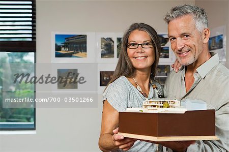 Mature Couple Holding Model of New Home