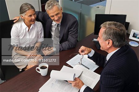 Mature Couple Talking with Financial Advisor
