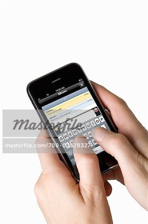 Hands Sending Instant Message on Smartphone