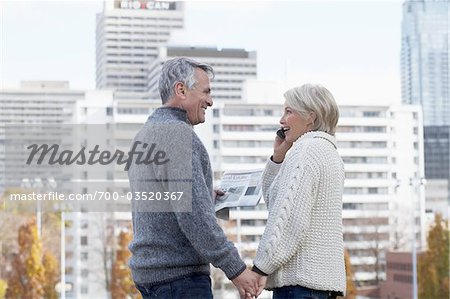 Couple Holding Hands with Buildings in background, Toronto, Ontario, Canada