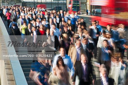 Commuters on London Bridge, London, England