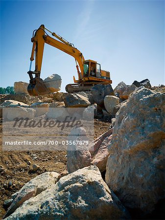 Excavator Moving Boulders at Amos Waites Park, Near Mimico Beach, Etobicoke, Ontario, Canada