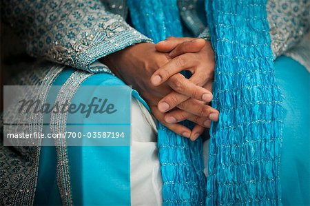 Groom with Clasped Hands