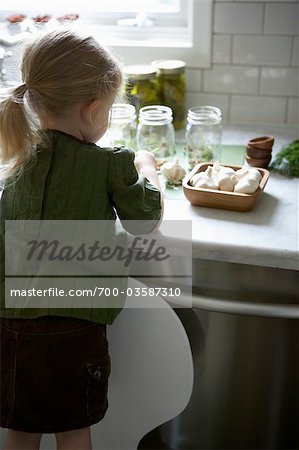 Young Girl Making Pickles