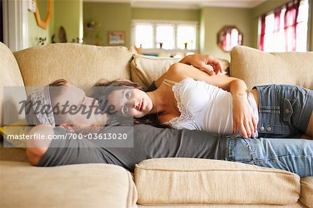 Couple Lying on Couch Together