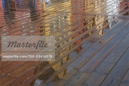 Bryggen Reflecting in Wet Boardwalk, Bergen, Hordaland, Norway