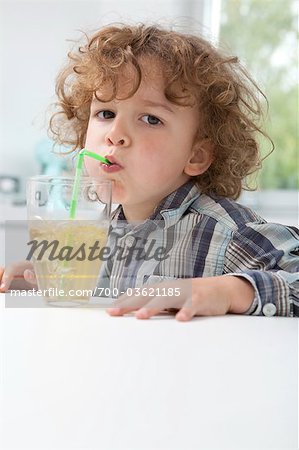 Little Boy Having a Drink