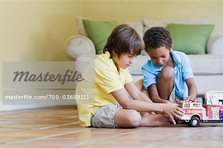 Boys Playing with Toy Fire Truck