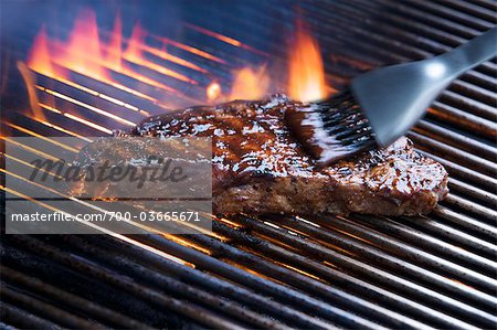 Brush Basting Steak with Barbeque Sauce