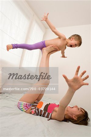 Brother and Sister Playing Airplane