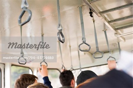 People Holding on to Handles in Cable Car, Grödig, Salzburg, Austria People Holding on to Handles in Cable Car, Grödig, Salzburg, Austria