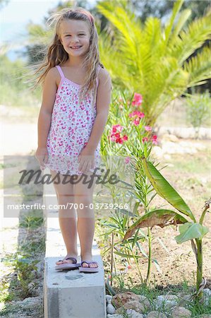 Girl Wearing Flip Flops and Sundress 
