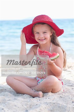 Girl Eating Watermelon at Beach